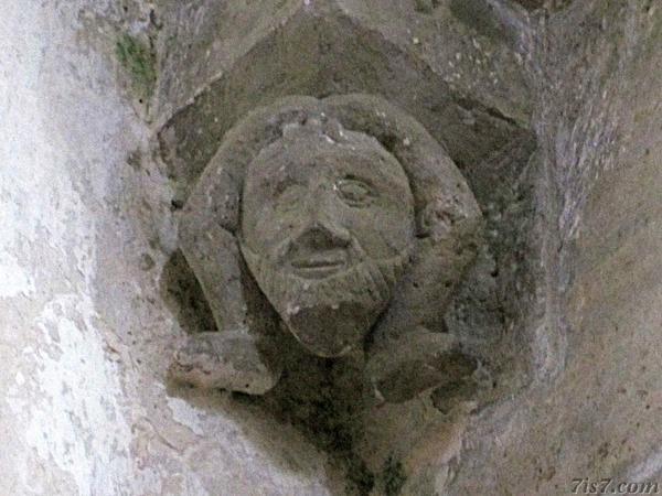Legged devil sculpture in Karja church