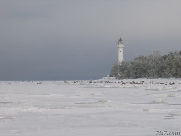 Saxby Lighthouse looking out over the frozen sea.